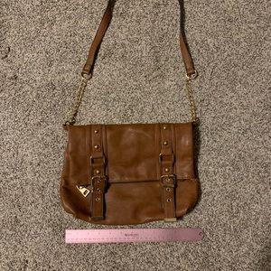 Brown cross body with bucket accent straps